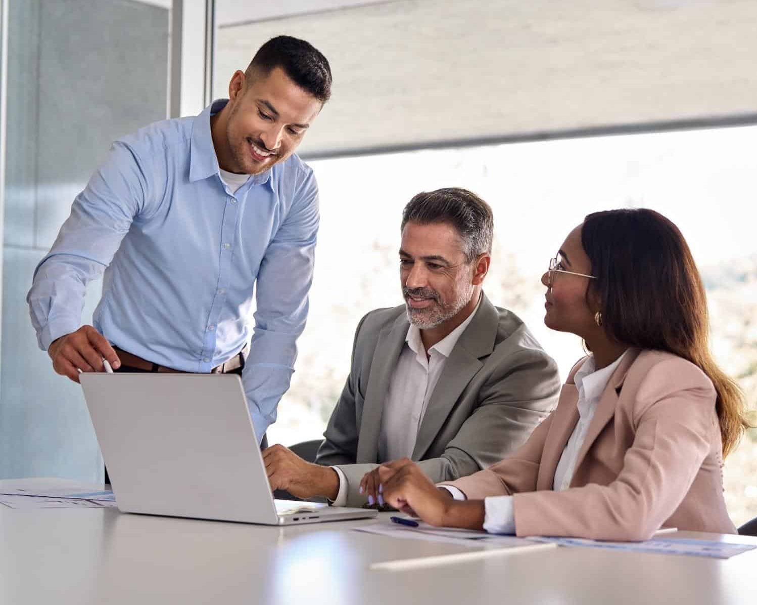 Business man explaining colleagues how to make use of Citymesh fixed internet connection
